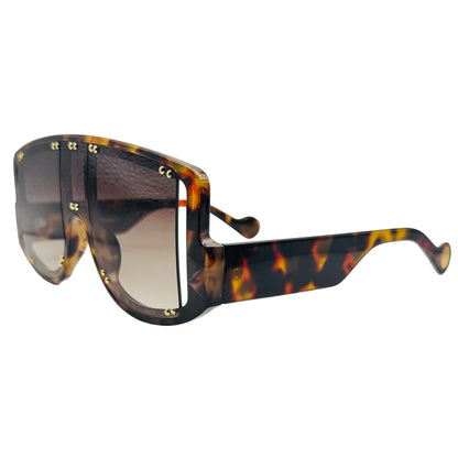 Sunglasses with tortoiseshell frame and dark lenses on a light gray background