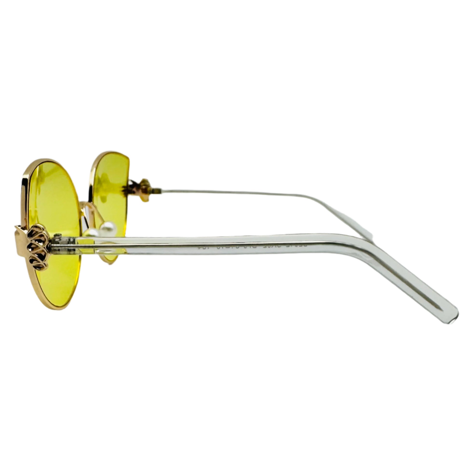 Sunglasses with yellow lenses and clear frame on a white background