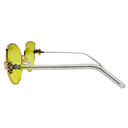 Sunglasses with yellow lenses and clear frame on a white background