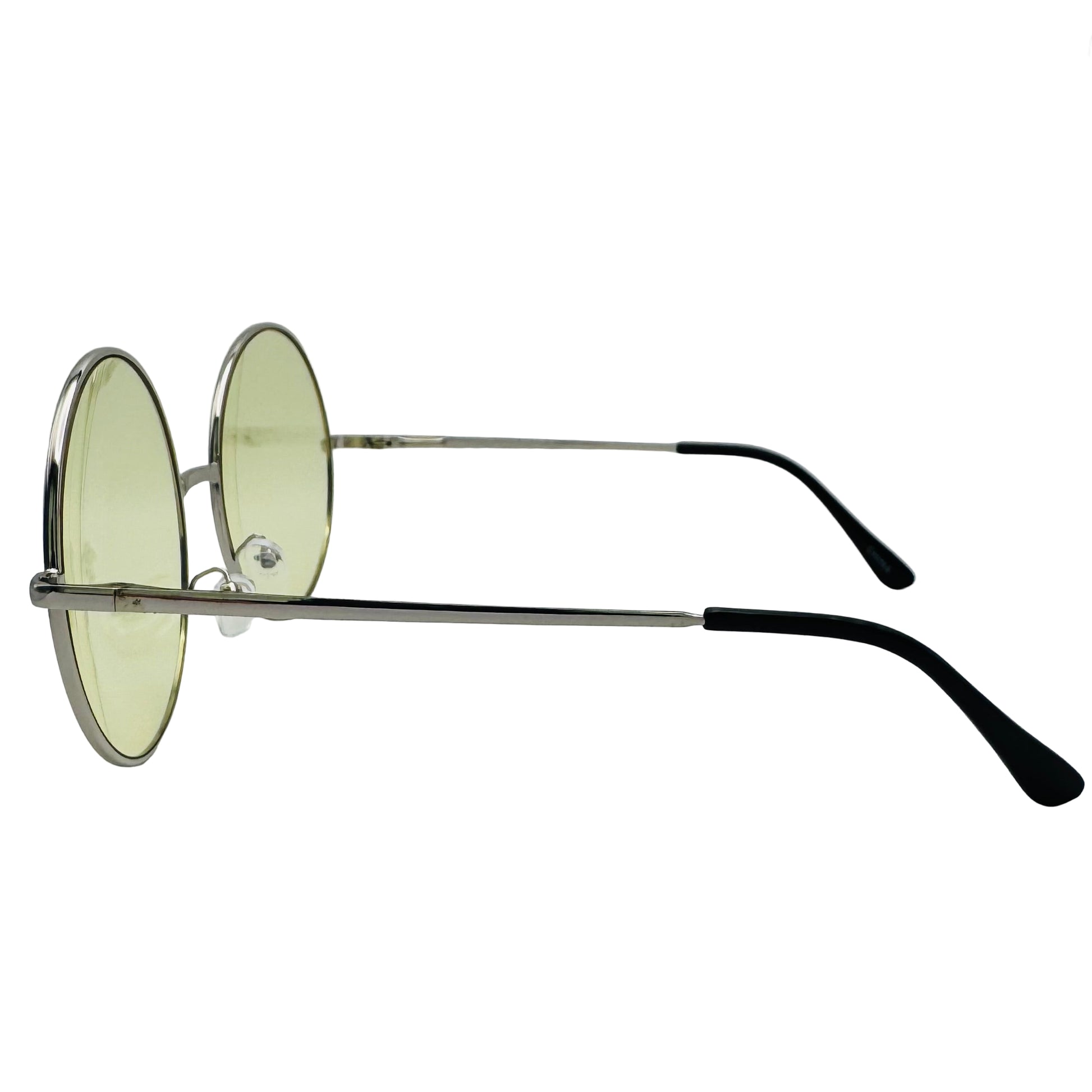 Round sunglasses with green lenses on a light gray background