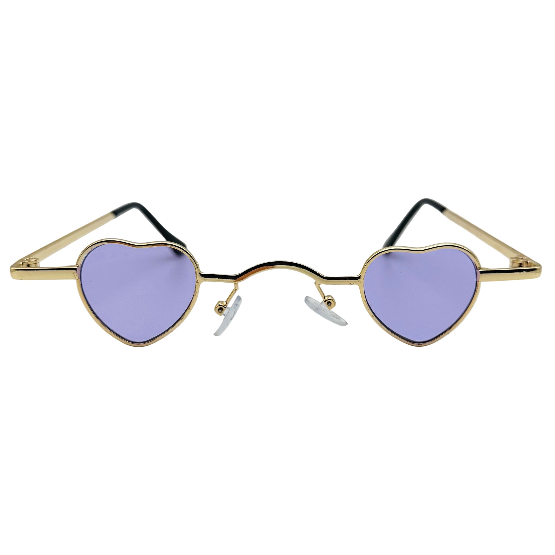 Heart-shaped sunglasses with gold frame and purple lenses on a light gray background