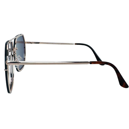 Sunglasses with a gold frame and tortoiseshell arms on a light gray background