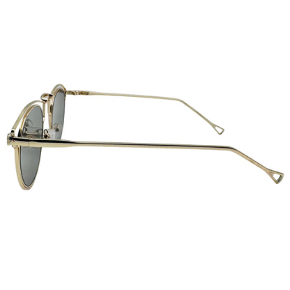 Gold-framed sunglasses on a light gray background