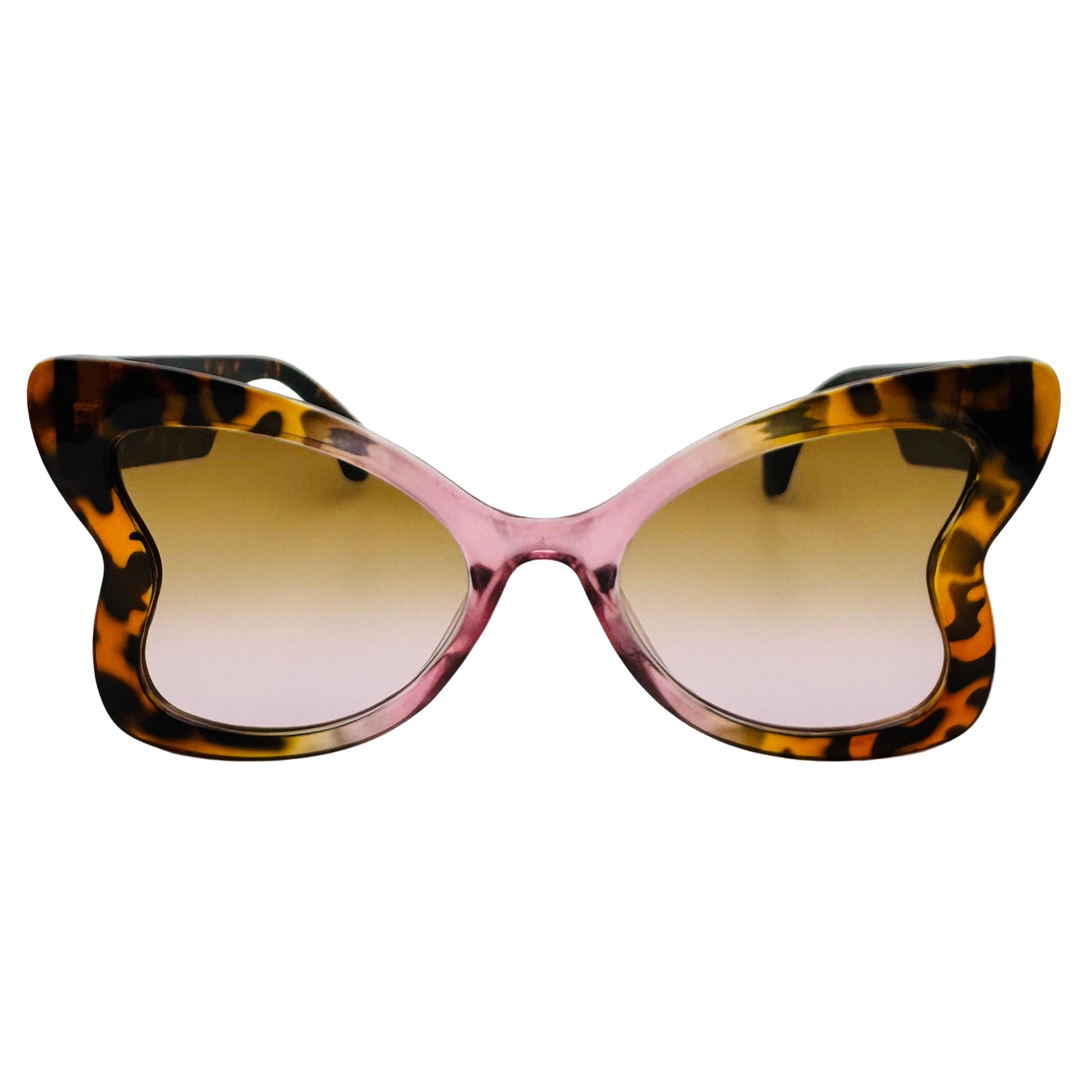 Cat-eye sunglasses with tortoiseshell frame and brown gradient lenses on a white background