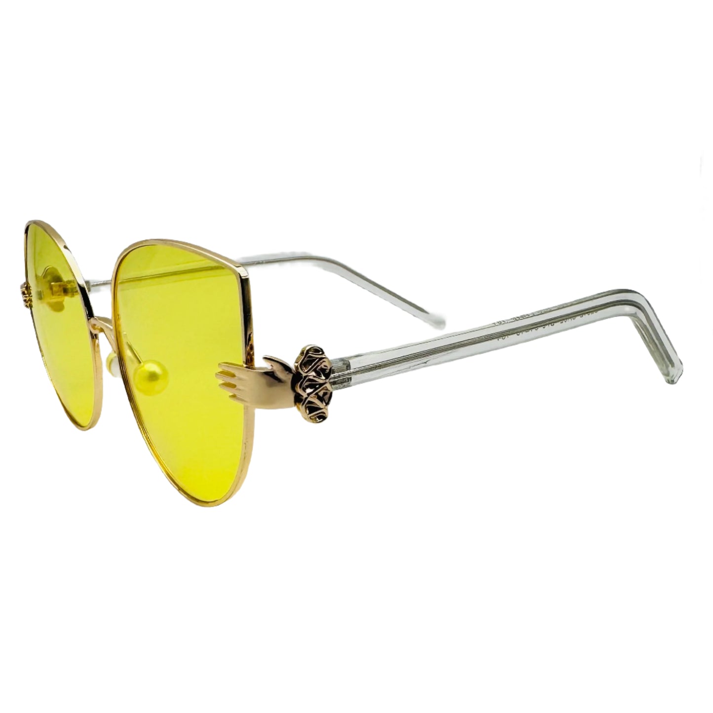 Sunglasses with yellow lenses and gold frames on a white background