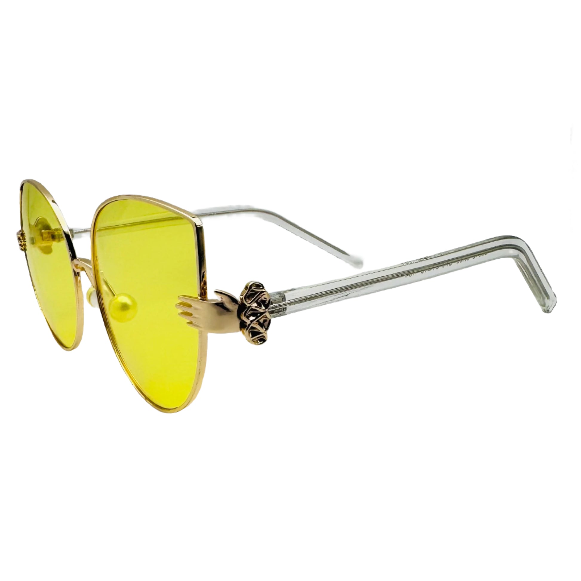 Sunglasses with yellow lenses and gold frames on a white background