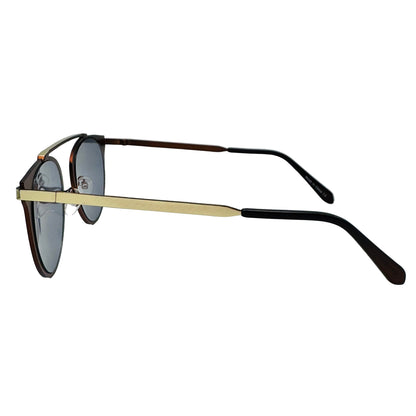 Sunglasses with gold and black frame on a light gray background