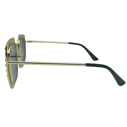 Sunglasses with gold frame and black arms on a light gray background