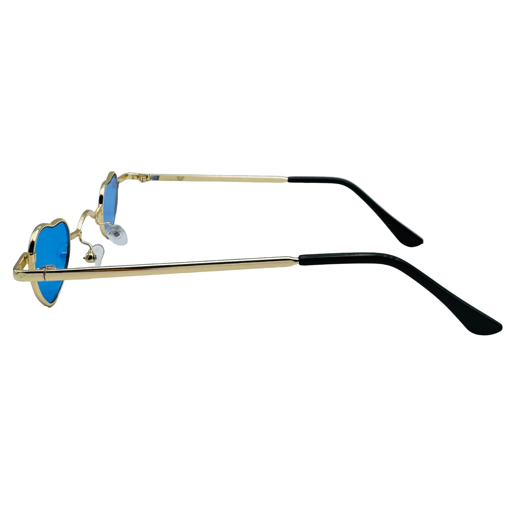 Sunglasses with gold frame and black arms on a light gray background