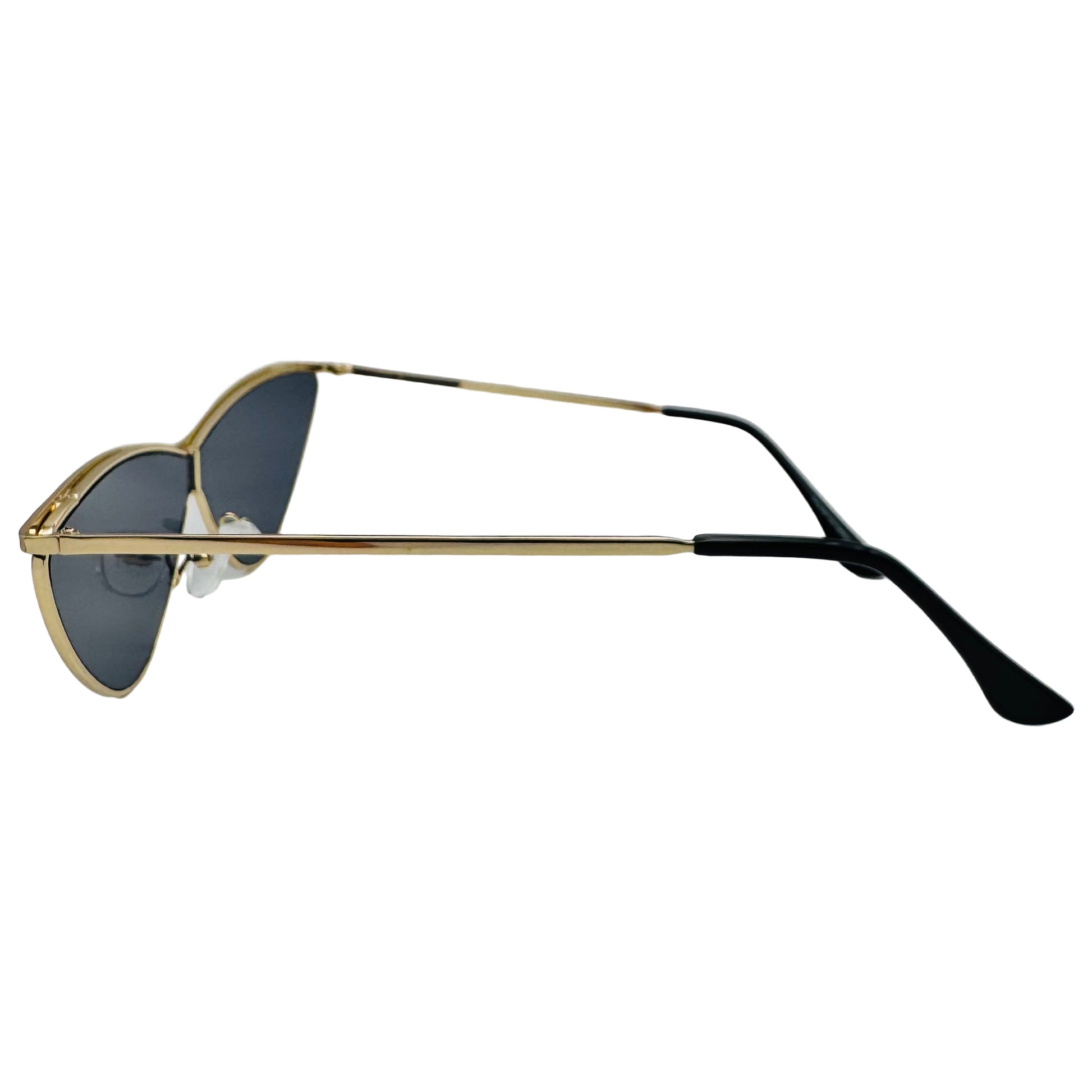 Sunglasses with gold frame and black arms on a white background