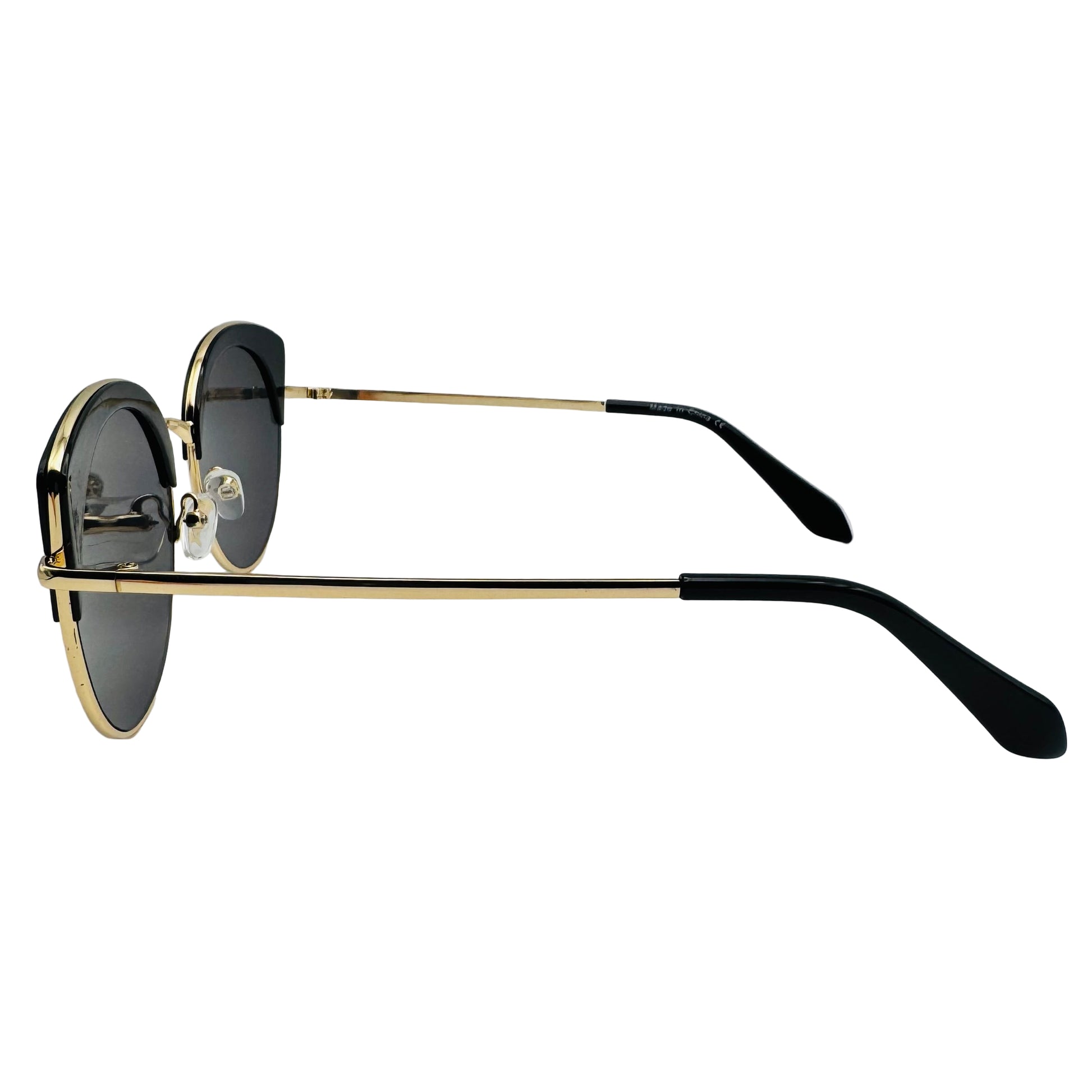 Sunglasses with gold frames and black lenses on a white background
