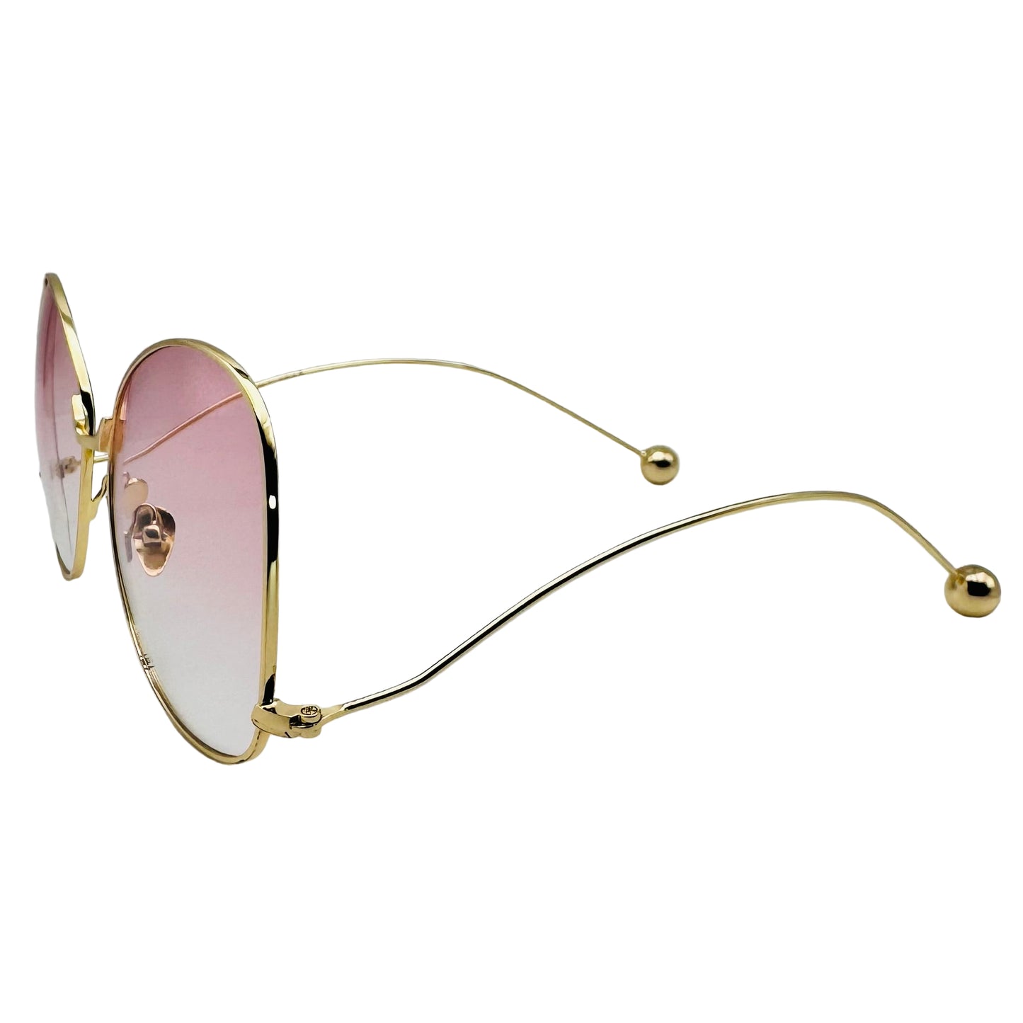 Gold-framed sunglasses with pink lenses on a white background