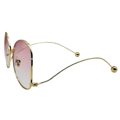 Gold-framed sunglasses with pink lenses on a white background