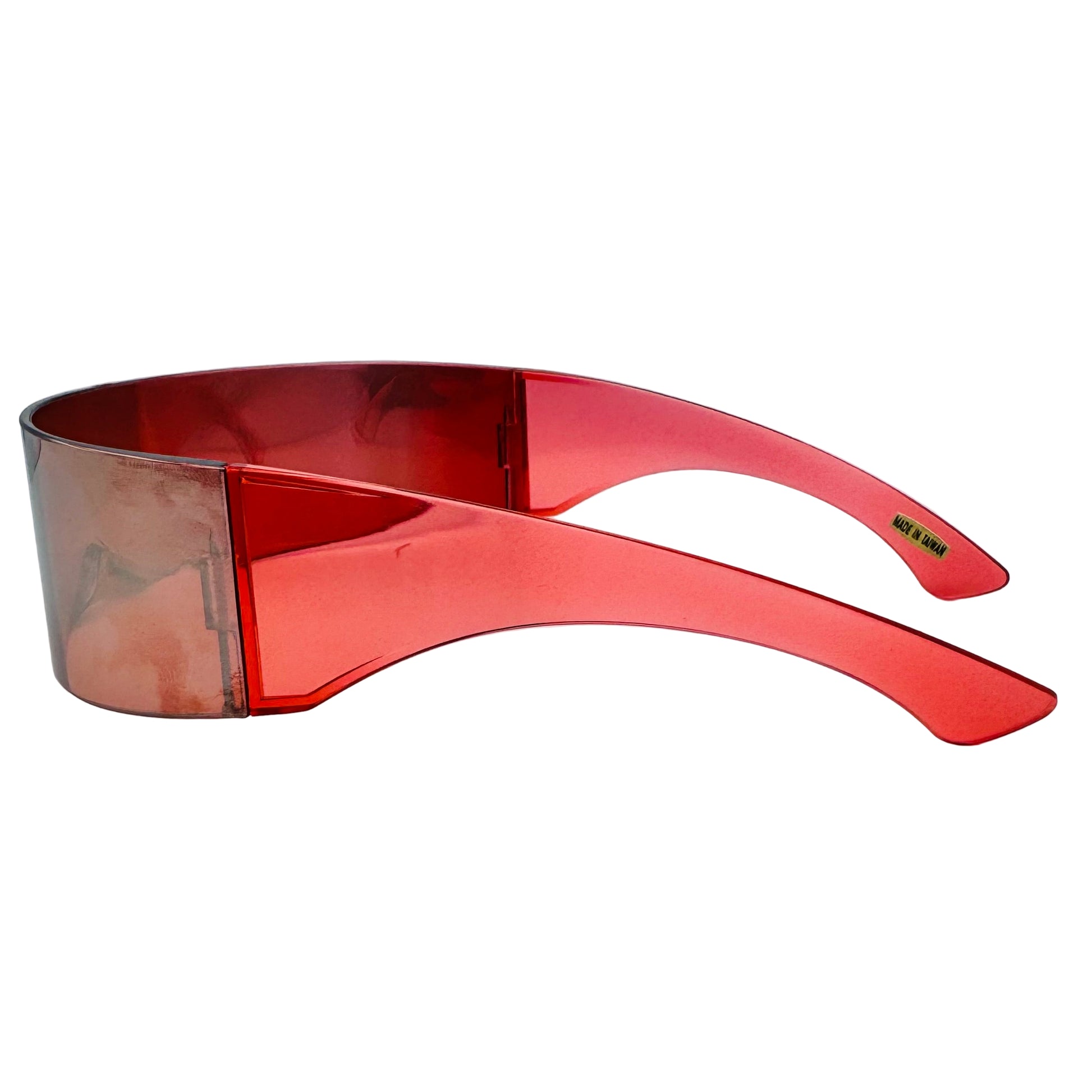 Red sunglasses with a clear lens on a light gray background