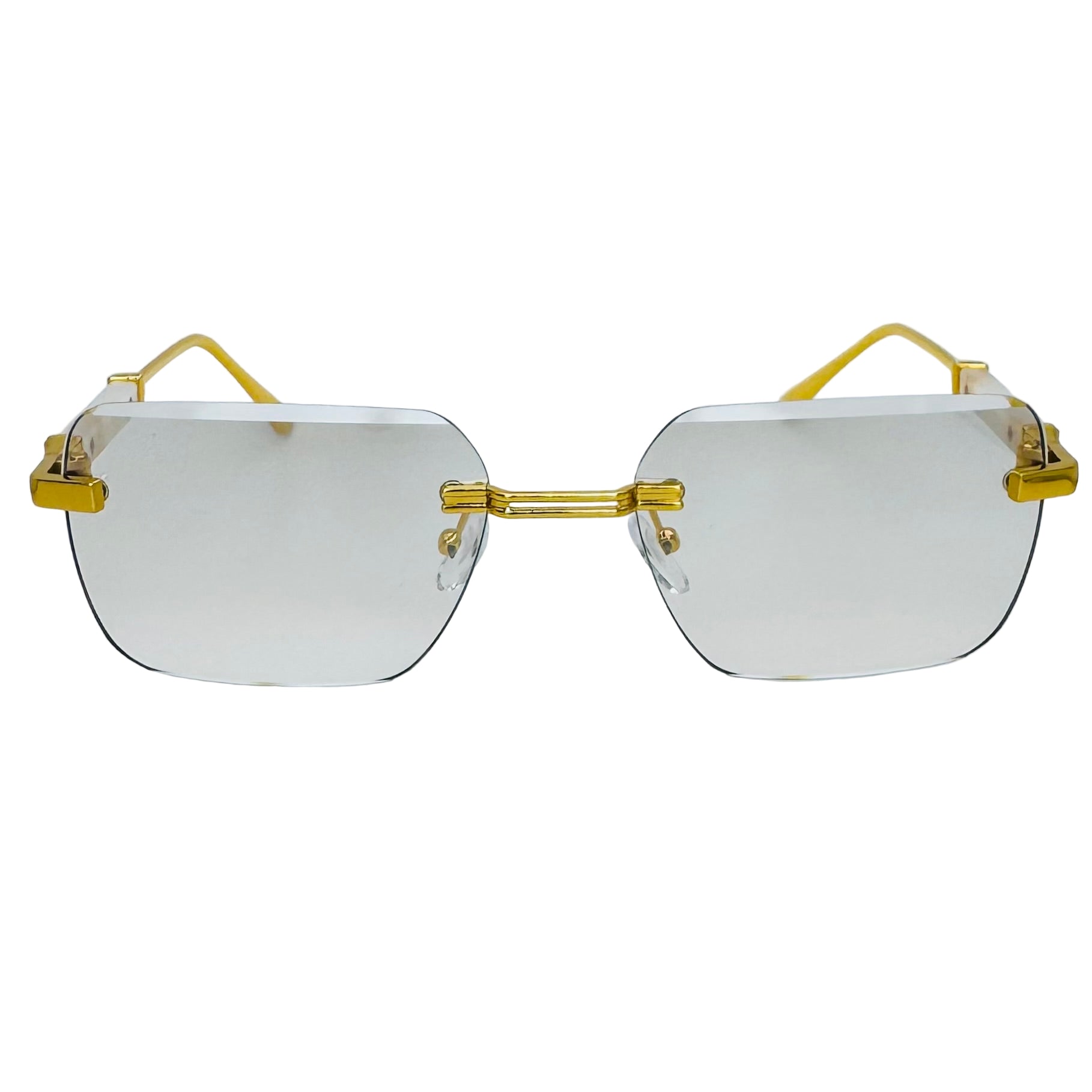 Gold-framed sunglasses with clear lenses on a light gray background