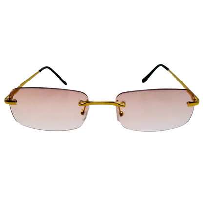 Sunglasses with gold frames and pink-tinted lenses on a white background