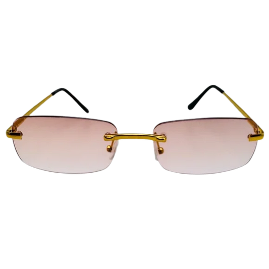 Sunglasses with gold frames and pink-tinted lenses on a white background