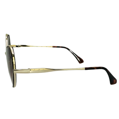 Gold-framed sunglasses with tortoiseshell accents on a white background