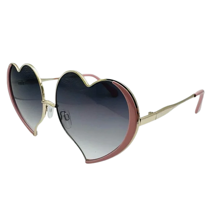 Heart-shaped sunglasses with gradient lenses on a white background