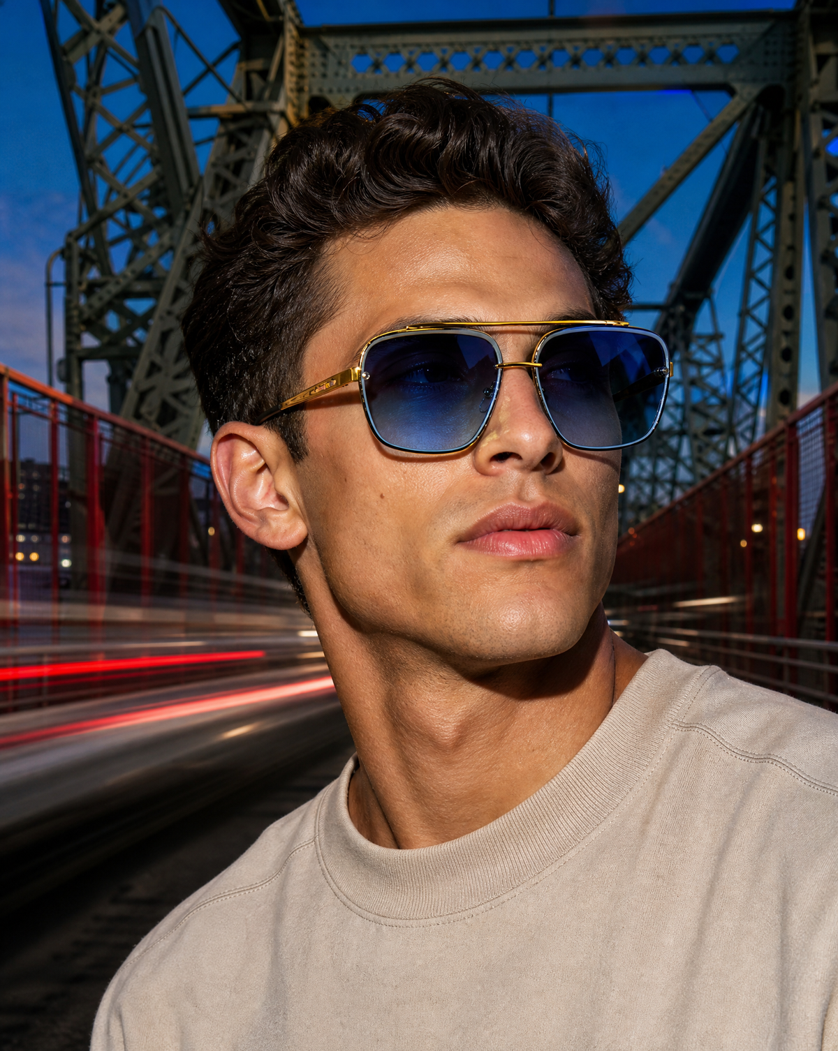 Model wearing the 5003 Boulevard square aviator flat-top sunglasses in Blue, showing the gold double brow bar, ribbed metal detailing, and blue gradient lenses