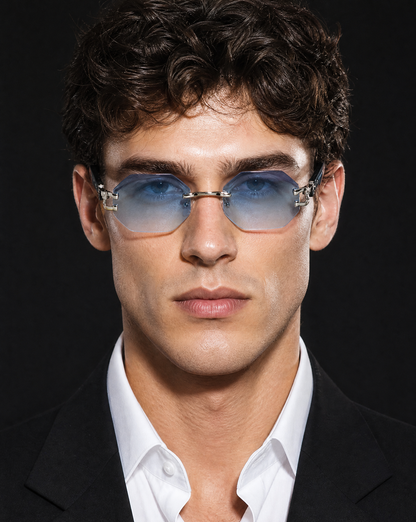 Model wearing the 5006 Facet rimless octagon sunglasses in Blue, showing the beveled octagonal lenses with blue gradient tint and polished metal corner hardware